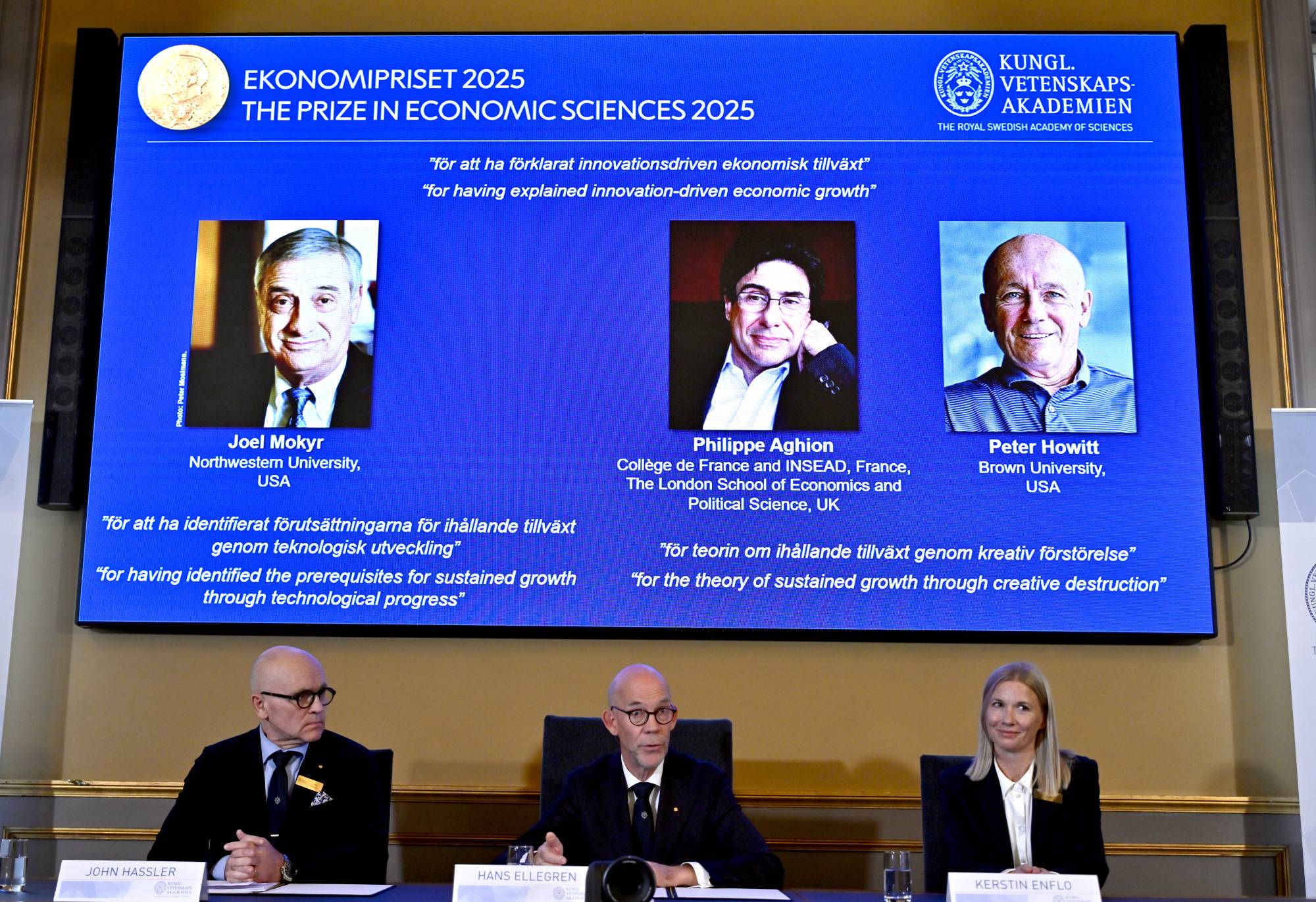 (from L) Professor John Hassler, Chairman of the Committee for the Prize in Economic Sciences in Memory of Alfred Nobel, Hans Ellegren, Permanent Secretary of the Academy of Sciences and Professor Kerstin Enflo, Member of the Committee for the Prize in Economic Sciences in Memory of Alfred Nobel announce the winners of the Nobel Prize in Economics 2025 in Stockholm, Sweden, 13 October 2025. The Sveriges Riksbank Prize in Economic Sciences in Memory of Alfred Nobel, the Nobel Prize in Economic Sciences 2025, is being awarded to Joel Mokyr, Northwestern University, Evanston, IL, USA, Philippe Aghion, College de France and INSEAD, Paris, France, The London School of Economics and Political Science, UK and Peter Howitt, Brown University, Providence RI, USA. EPA/ANDERS WIKLUND SWEDEN OUT