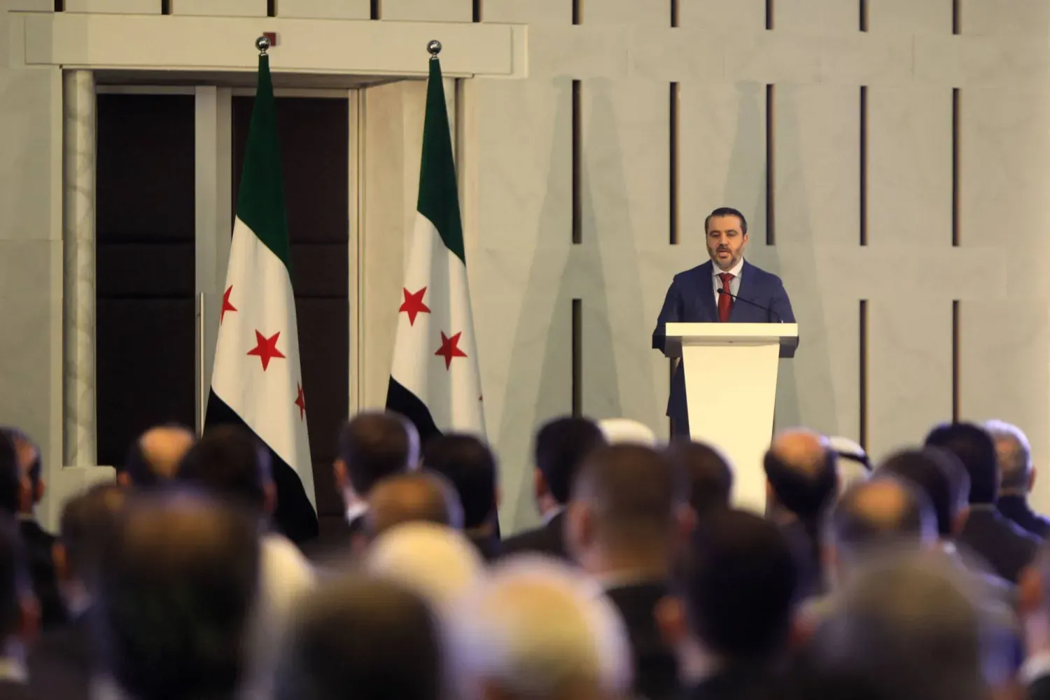 Suriye Dışişleri Bakanı Esad eş Şeybani Şam'daki başkanlık sarayında konuşuyor (AFP)