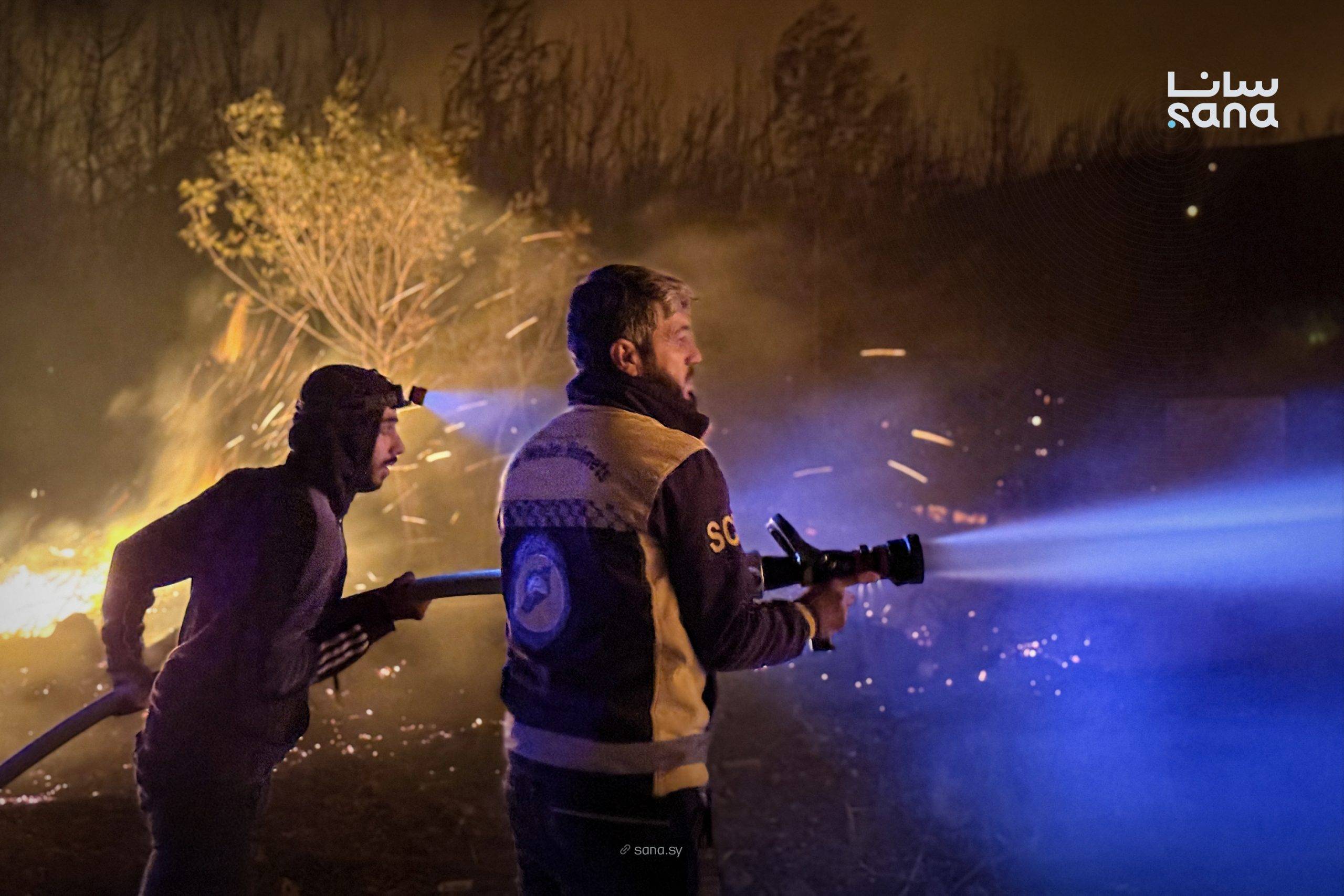 İtfaiyeciler Suriye'nin Lazkiye kırsalındaki yangınları kontrol altına almaya çalışıyor (SANA)