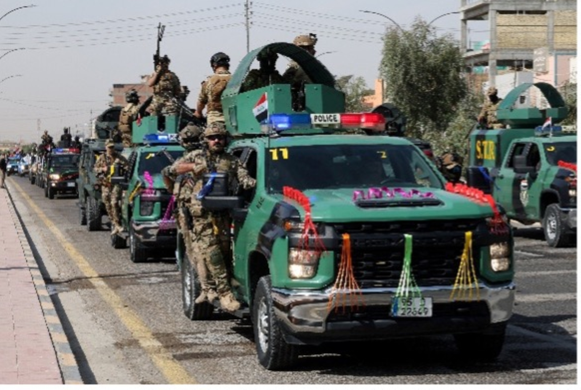 30 Eylül 2026 tarihinde Irak’ın Necef kentinde, ABD önderliğindeki koalisyon güçlerinin Irak’tan çekilmesini kutlamak amacıyla Irak güvenlik güçlerinden bazı mensuplar şehirde bir geçit töreni düzenledi. (Reuters)