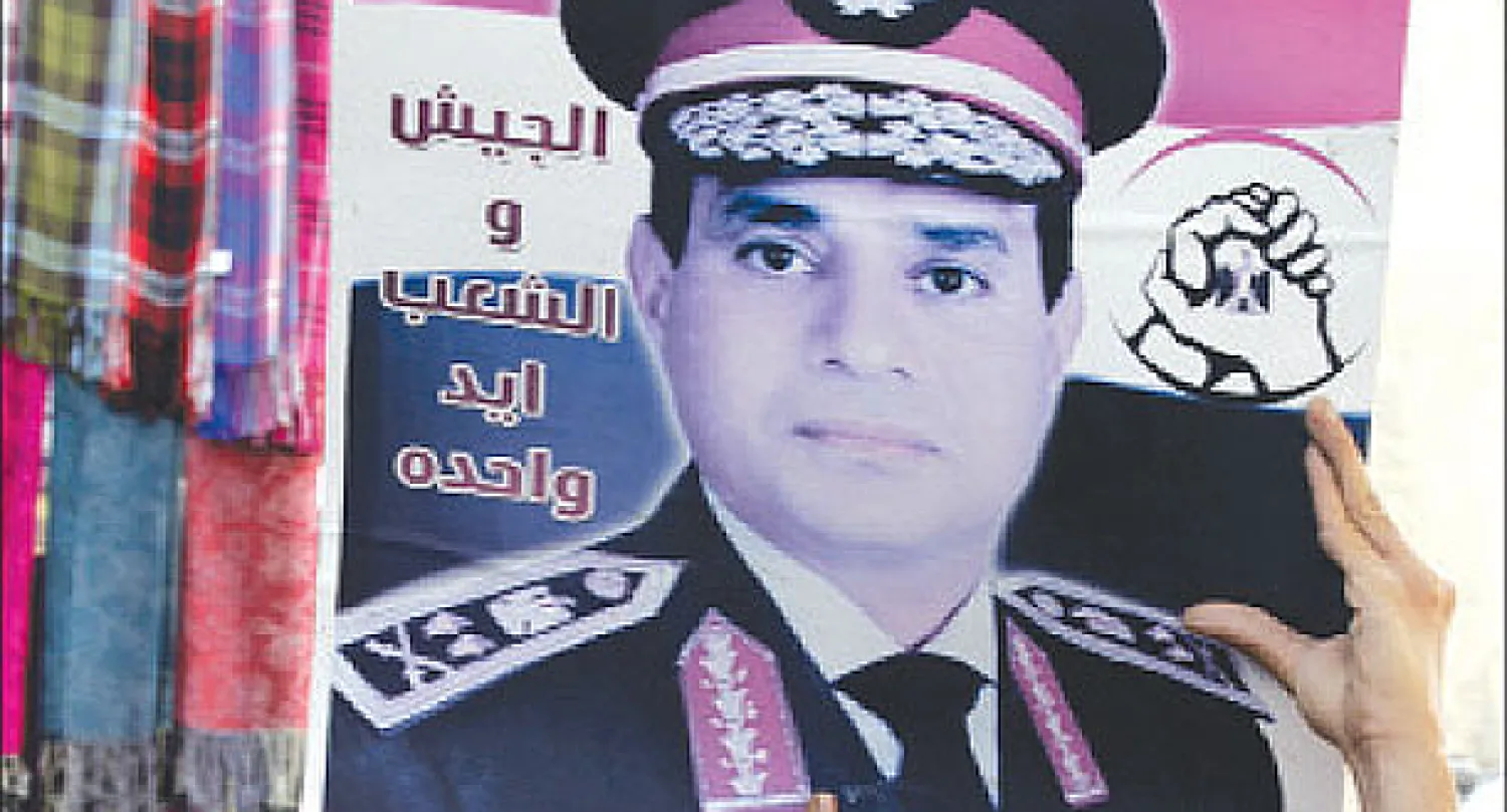 حملة شعبية مصرية تدعو الفريق أول عبد الفتاح السيسي النائب الأول لرئيس الوزراء ووزير الدفاع المصري للترشح للانتخبات الرئاسية (إ.ب.أ)