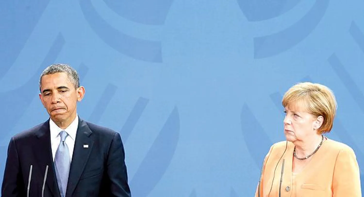 أوباما وميركل خلال مؤتمر صحافي مشترك ببرلين في 19 يونيو الماضي (رويترز)