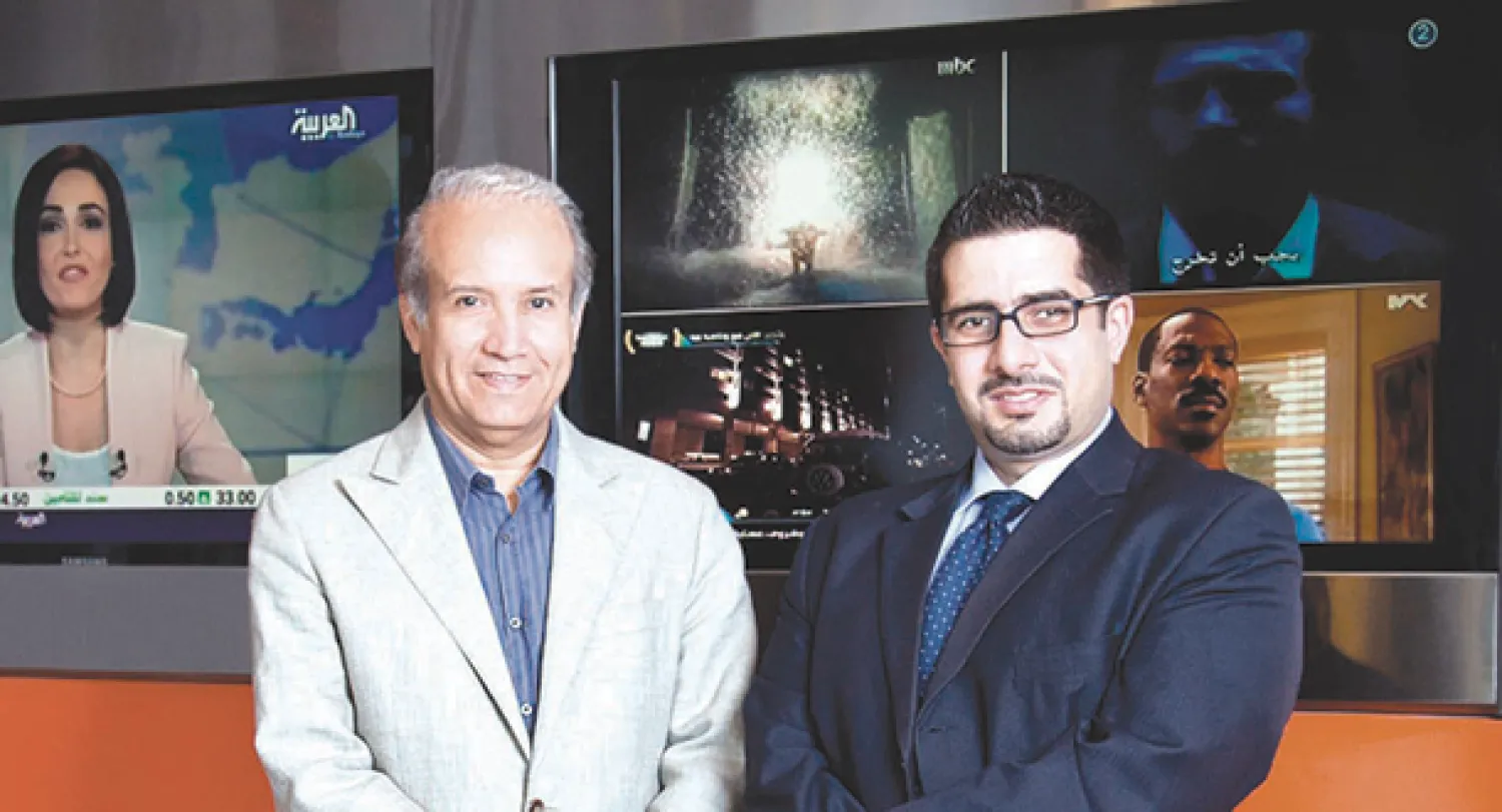  المدير العام لقناة {العربية} عبد الرحمن الراشد والزميل فيصل عباس رئيس تحرير الموقع الإنجليزي ({الشرق الأوسط}) 