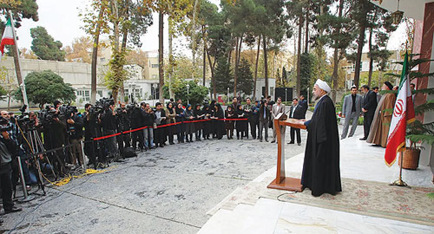 الرئيس الإيراني حسن روحاني يعقد مؤتمرا صحافيا في طهران صباح أمس بعد الإعلان عن الاتفاق (أ.ف.ب)
