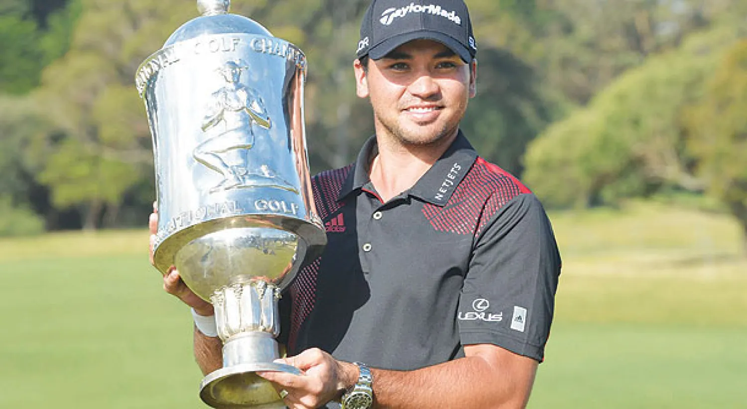 داي يحتفل بكأس العالم للغولف (إ.ب.أ)