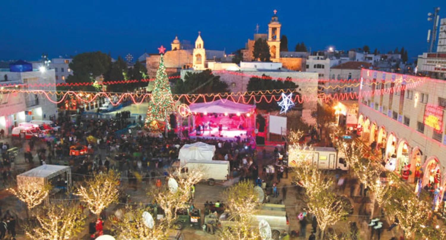 جانب من احتفالات عيد الميلاد في ساحة المهد في بيت لحم أمس (أ.ب)