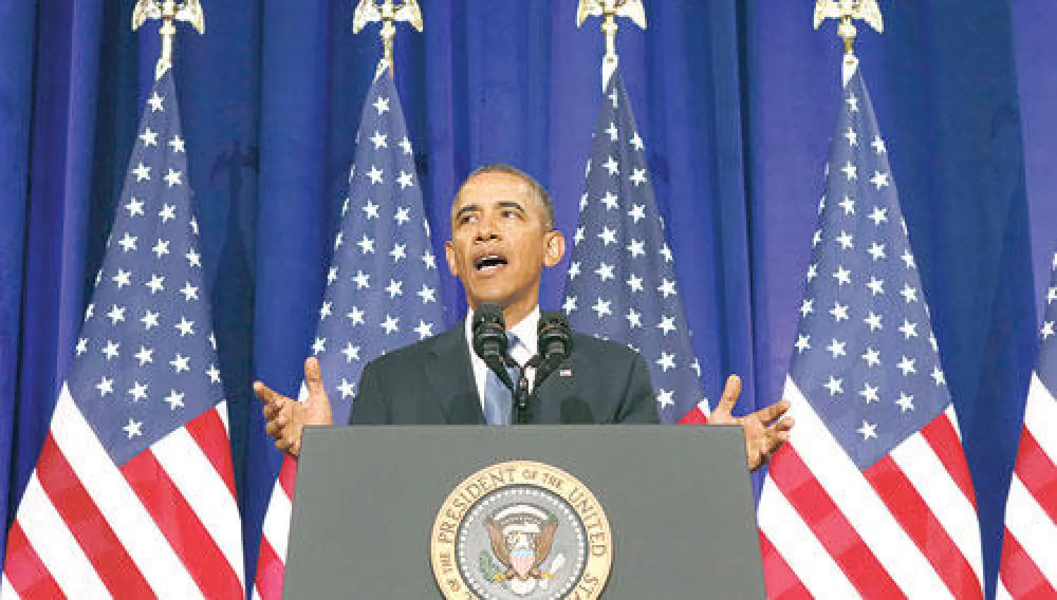 أوباما أثناء إعلانه عن إصلاحات في مجال عمل الاستخبارات في مقر وزارة العدل بواشنطن أول من أمس (رويترز)