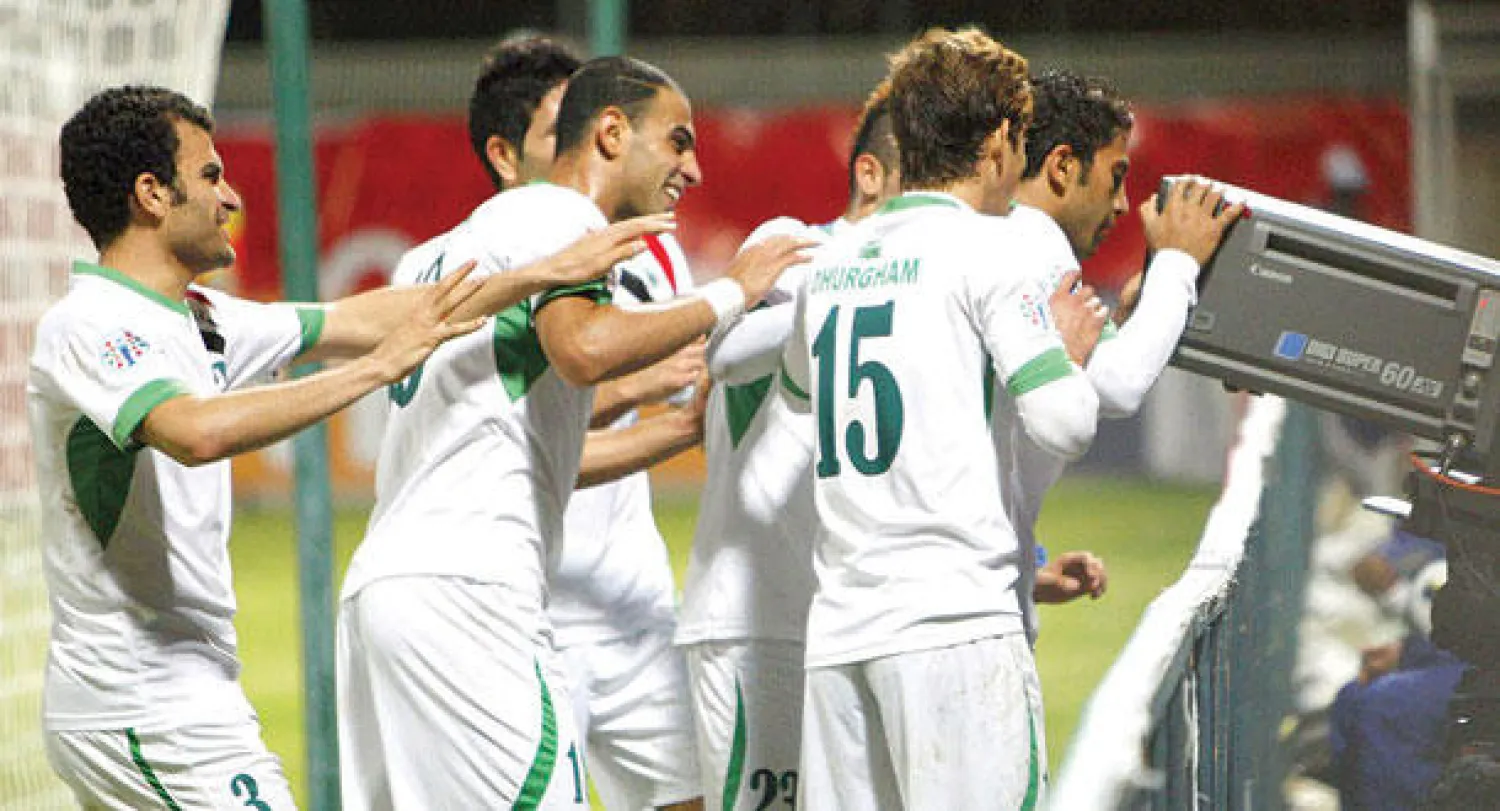 لاعبو العراق يحتفلون بهدف الفوز أمام كوريا الجنوبية (أ.ف.ب)