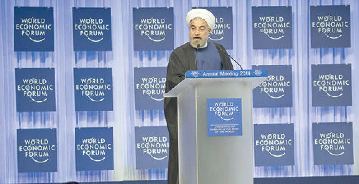 الرئيس الايراني  حسن روحاني يلقي خطابه في منتدى دافوس امس (أ.ب)