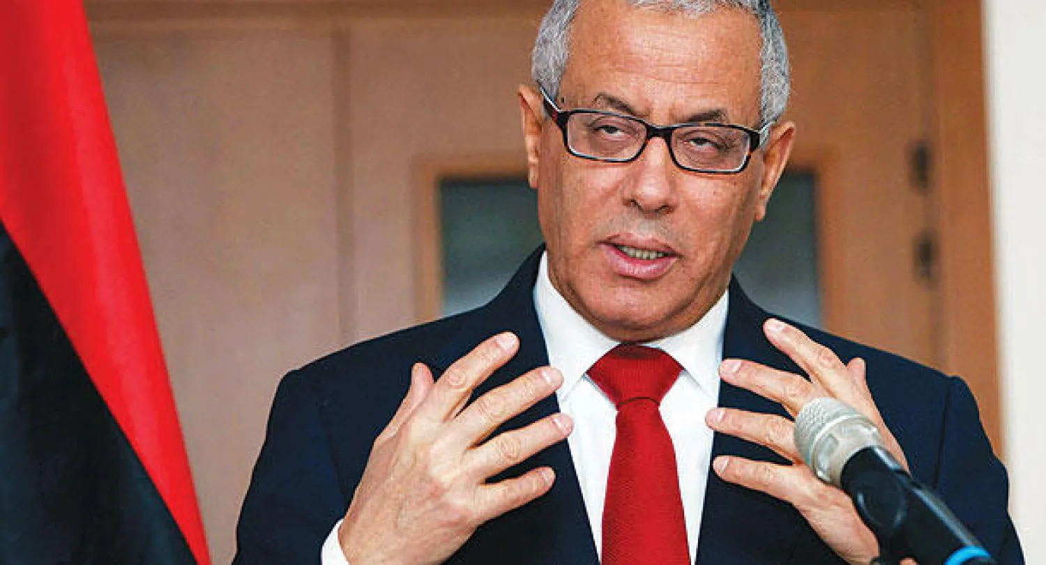 علي زيدان يتحدث في مؤتمر صحافي أمس (رويترز)