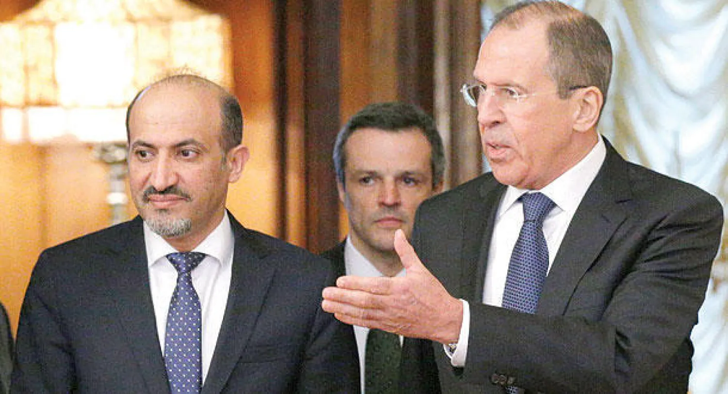 لافروف والجربا خلال لقائهما في موسكو أمس (أ.ب)