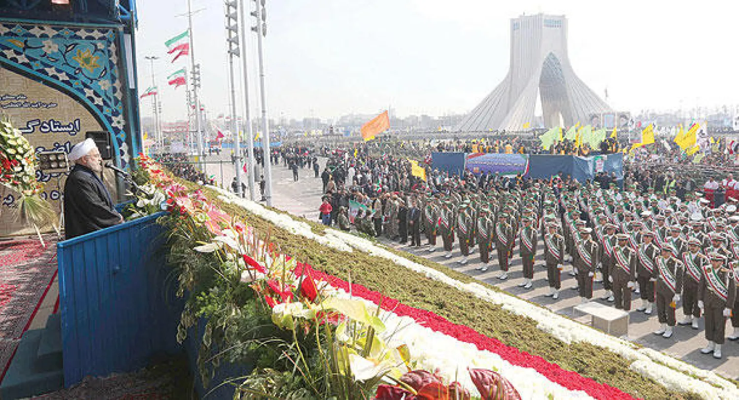 الرئيس الايراني حسن روحاني لدى القائه خطابه في الذكرى الـ35 للثورة الايرانية في طهران أمس (أ. ف. ب)