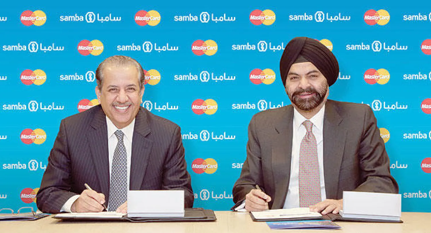 عيسى العيسى وأجاي بانغا خلال توقيع الاتفاقية («الشرق الأوسط»)