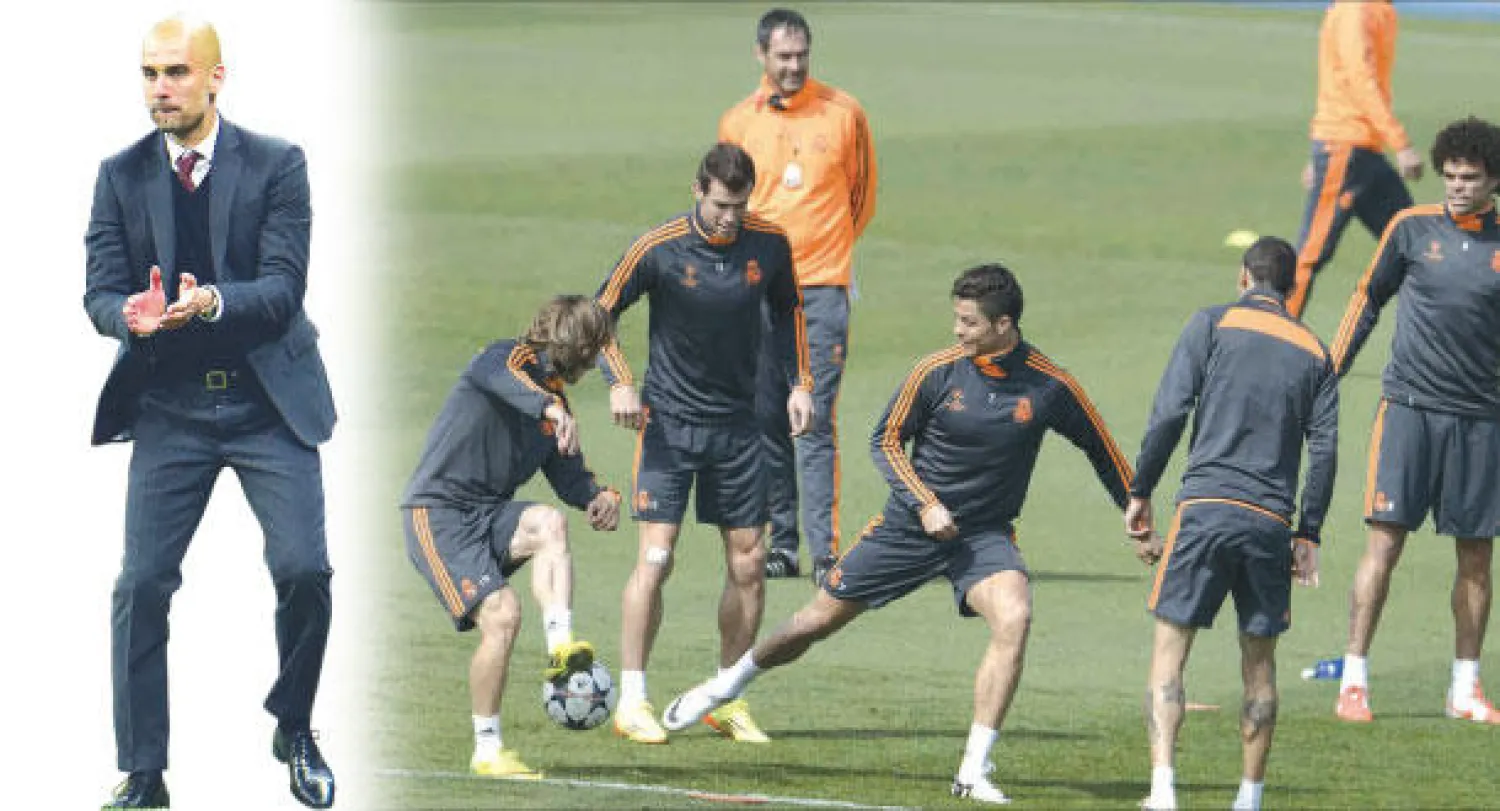 رونالدو (وسط) يقود ريـال مدريد اليوم في مواجهة بايرن (أ.ف.ب)  -  غوارديولا يبحث عن لقب قاري جديد مع بايرن ميونيخ (أ.ب)