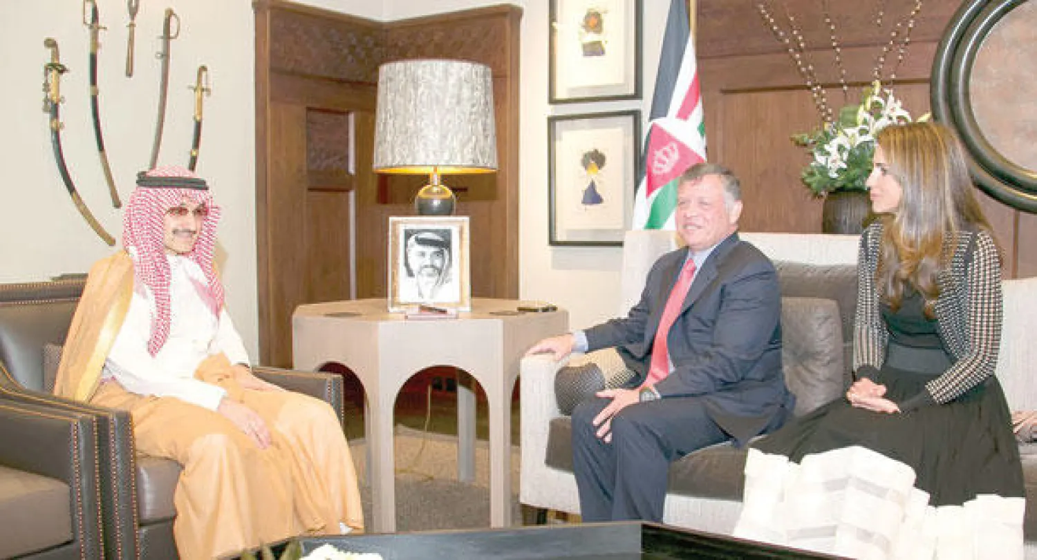 الملك عبد الله والملكة رانيا مع الأمير الوليد