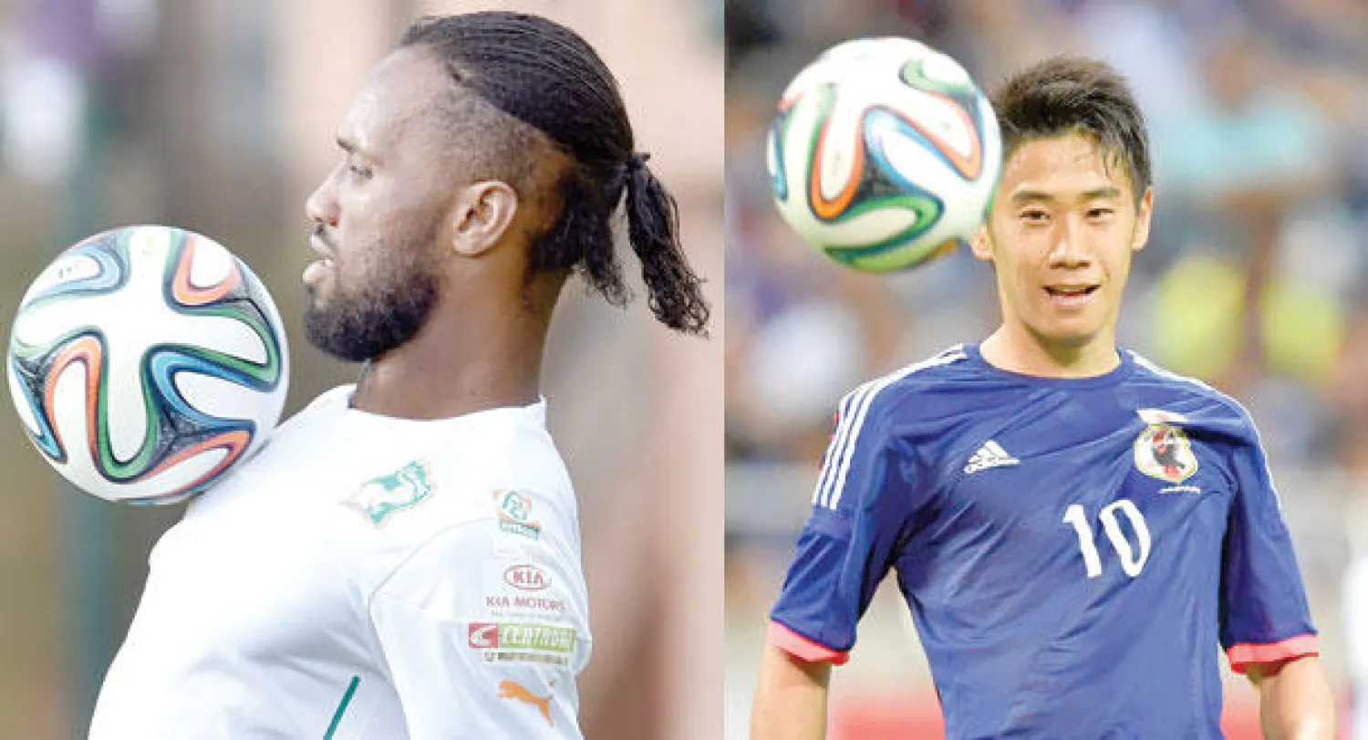 شينجي كاغاوا قوة في منتخب اليابان (أ.ف.ب)  -  دروغبا خبرة وخطورة في منتخب كوت ديفوار (أ.ف.ب)