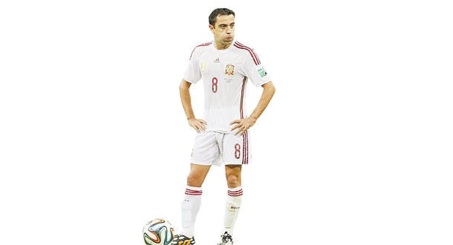 تشافي يبدو متأثرا بالخسارة الكبيرة أمام هولندا (إ.ب.أ)