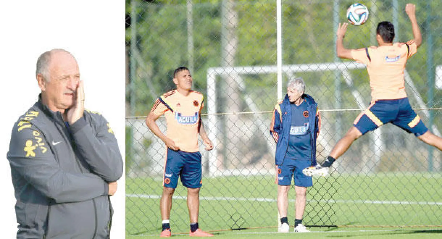 بيركمان مدرب كولومبيا يراقب تدريبات لاعبيه قبل مواجهة البرازيل الحاسمة (أ.ف.ب)  -  سكولاري مدرب البرازيل يفكر في خطة لمواجهة كولومبيا