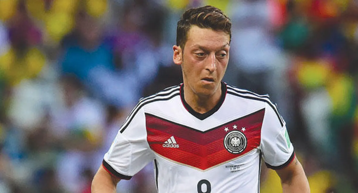 أوزيل عاد لمستواه في دور الـ16 (أ.ف.ب)