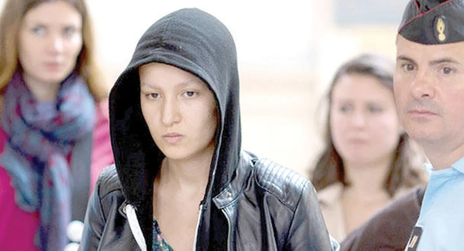 أمينة أثناء احتجازها في باريس (أ.ف.ب)