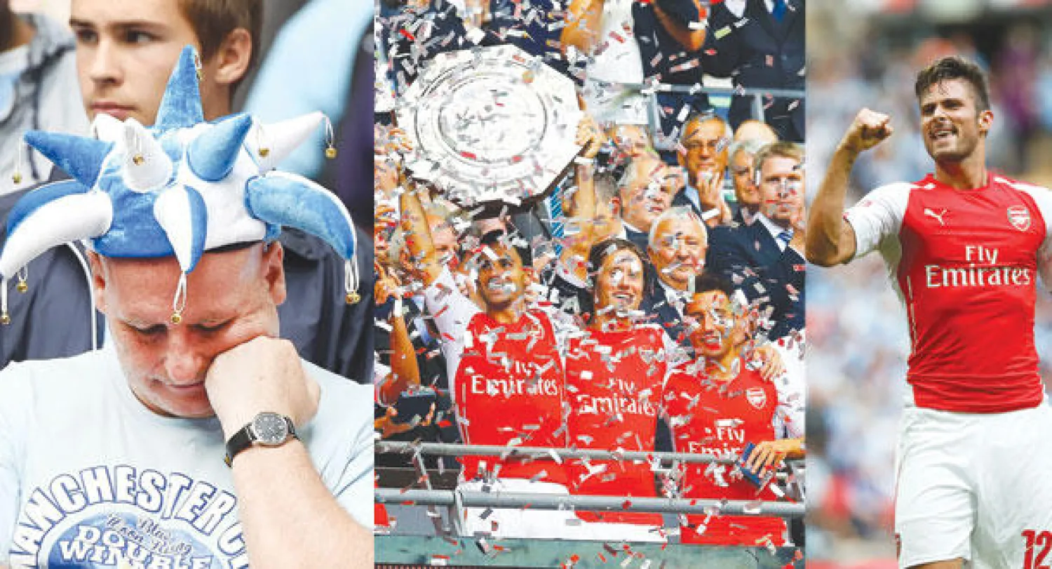 الفرنسي  جيرو بعد اختتامه أهداف آرسنال (أ.ب)   -  لاعبو آرسنال ومدربهم يحتفلون بالدرع الخيرية (رويترز)  -  أحداث المباراة على وجوه مشجعي مانشستر سيتي (إ.ب.أ)