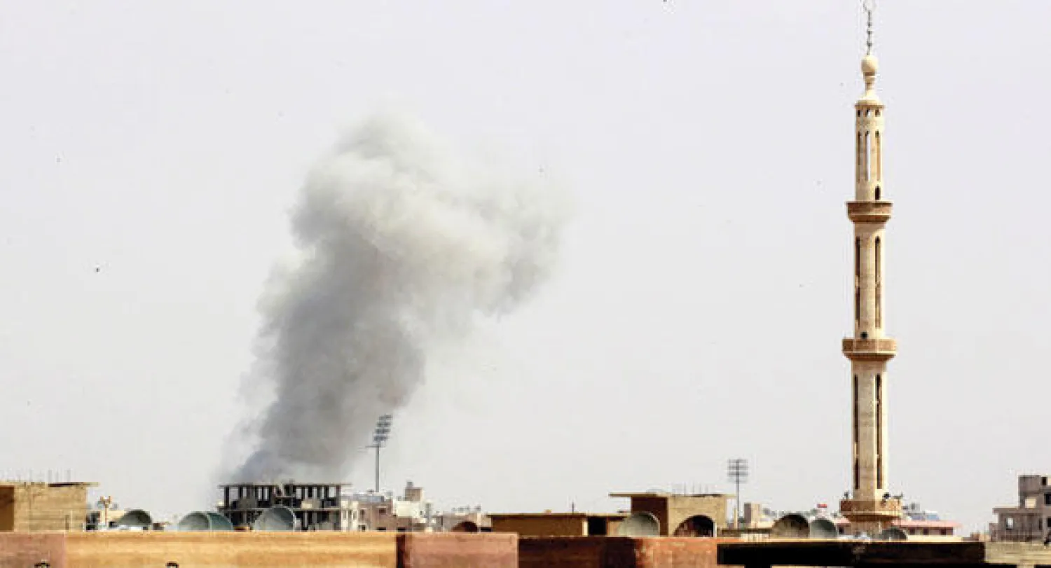 دخان يتصاعد بعد قصف جوي من النظام السوري على مدينة الرقة أول من أمس (رويترز)