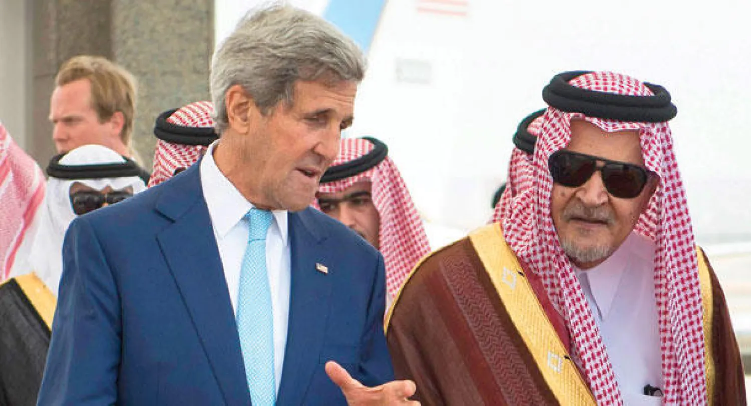 الأمير سعود الفيصل لدى استقباله كيري أمس (رويترز)