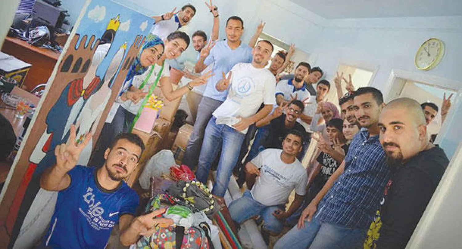 عراقيون يحضرون لاحتفالات «يوم السلام العالمي» في بغداد («الشرق الأوسط»)