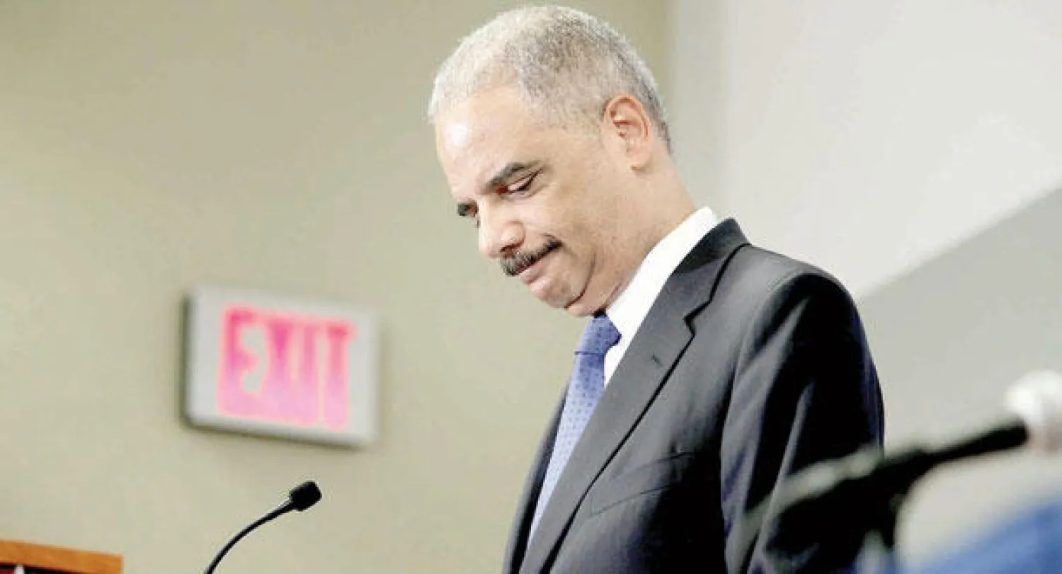 هولدر يتحدث خلال مؤتمر في الكونغرس بواشنطن أمس (أ.ف.ب)