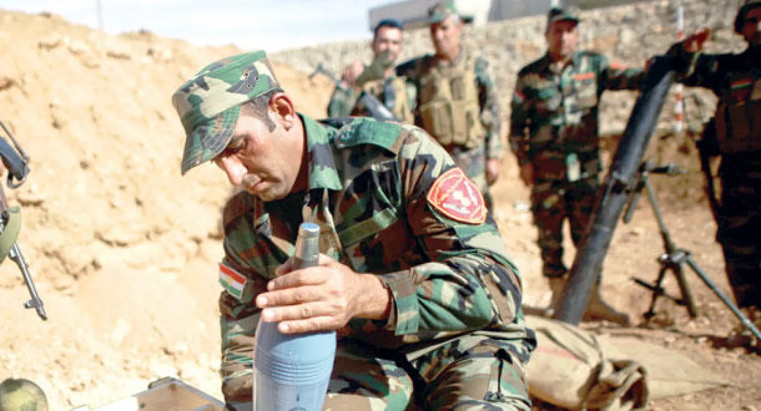 عناصر من مقاتلي «البيشمركة» ضد «داعش» في حالة تأهب أمس (أ.ف.ب)