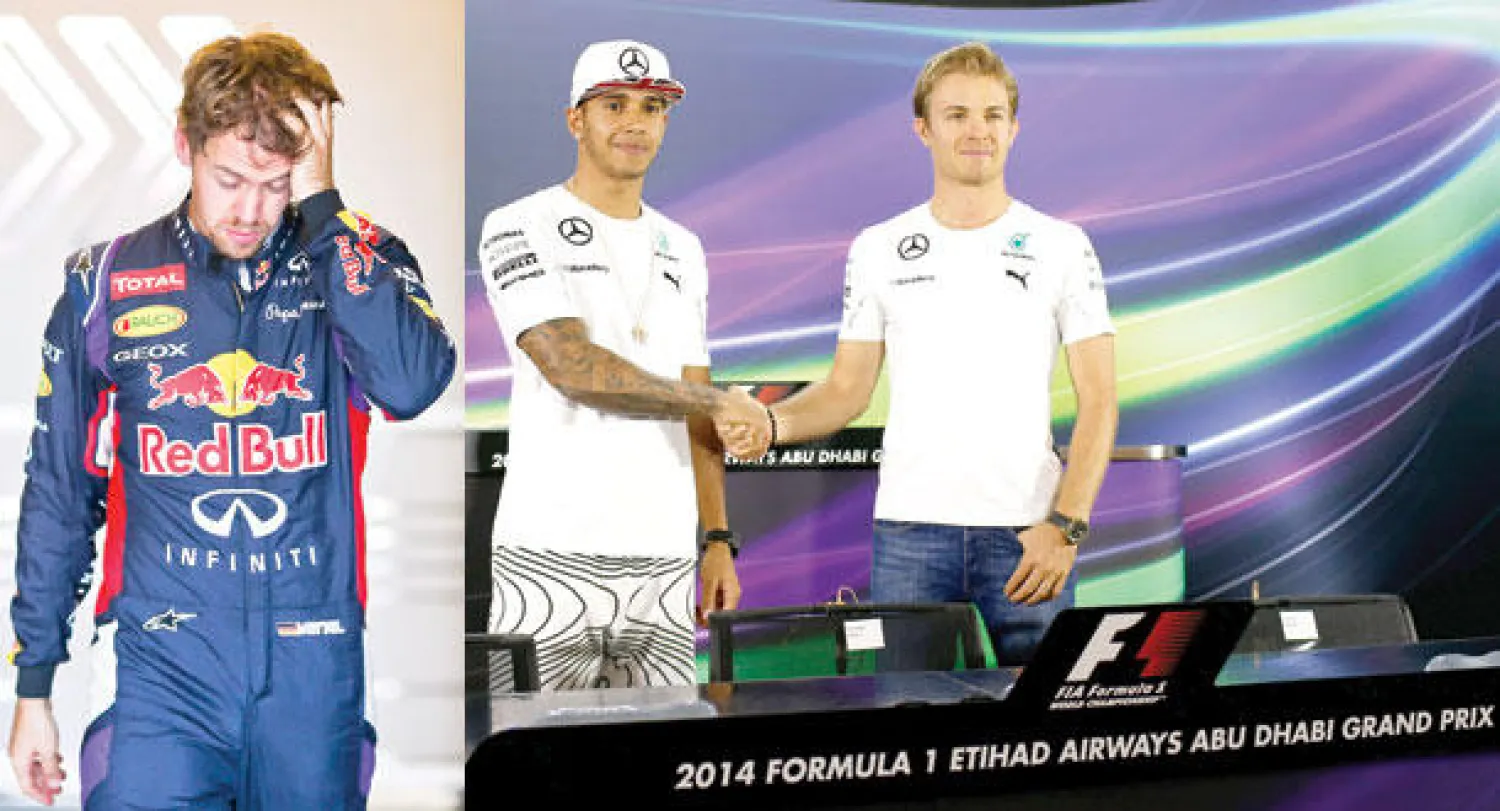 هاميلتون (يسار) مع زميله روزبرغ حيث يتحول اشتراكهما في فريق مرسيدس إلى صراع ساخن على حلبة أبوظبي (إ.ب.أ)  -  فيتيل سيغادر فريق ريد بول بعد سباق أبوظبي