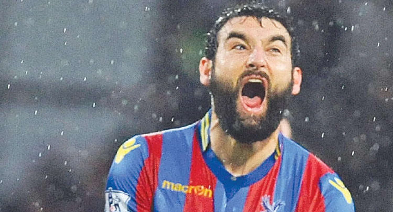 جيديناك لاعب بالاس يحتفل بهدفه في مرمى ليفربول (إ.ب.أ)