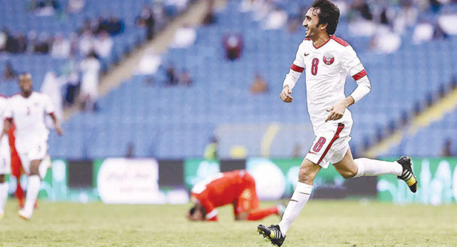 أسد يحتفل بأحد أهدافه في مرمى عمان (تصوير: علي العريفي)