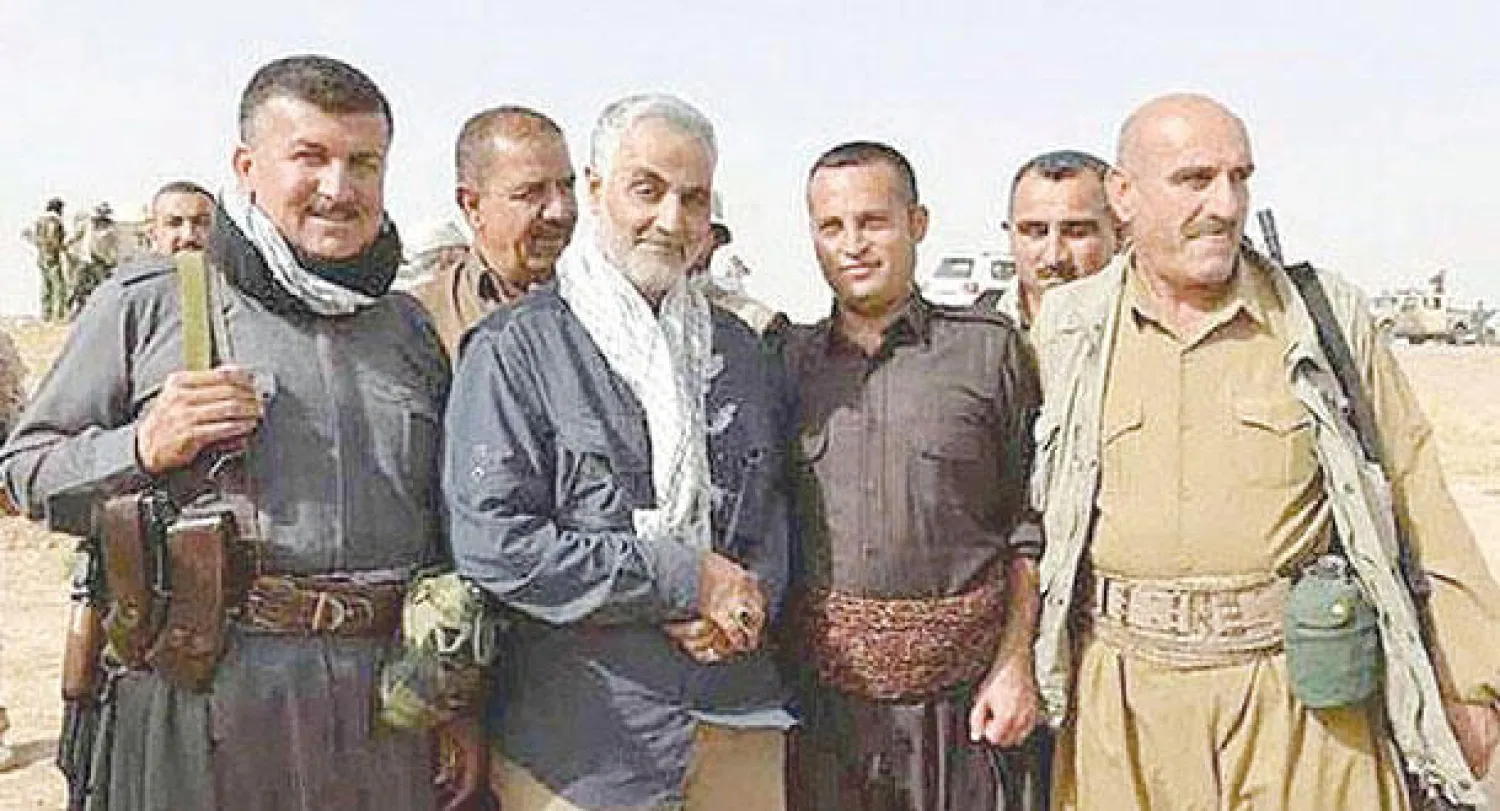 صورة بثتها وكالة أنباء فارس لقائد الحرس الثوري الإيراني قاسم سليماني مع مقاتلين في البيشمركة داخل الأراضي العراقية («الشرق الأوسط»)
