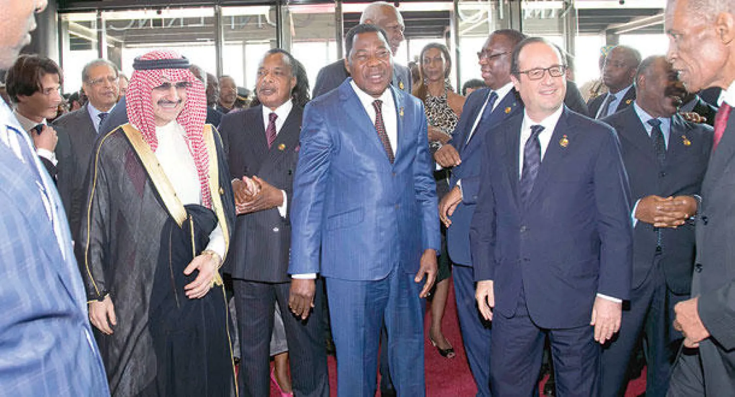 الوليد بن طلال مع الرئيسين الفرنسي والسنغالي