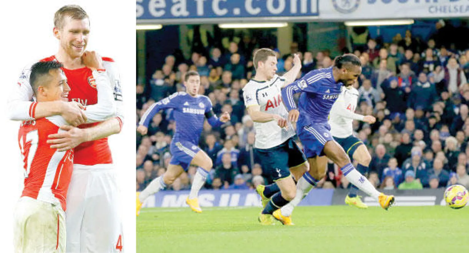المخضرم دروغبا يخترق دفاع توتنهام ويعزز تقدم تشيلسي (أ.ب)  -  سانشيز (17) يحتفل مع بير ميرتساكربعد إحرازه هدف فوز آرسنال (أ.ب)