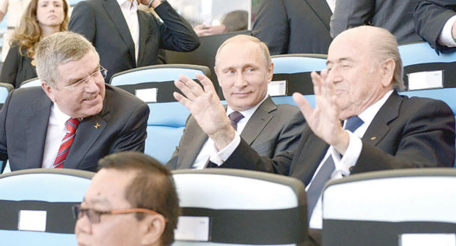 بوتين وباخ وبلاتر في مناسبة رياضية سابقة