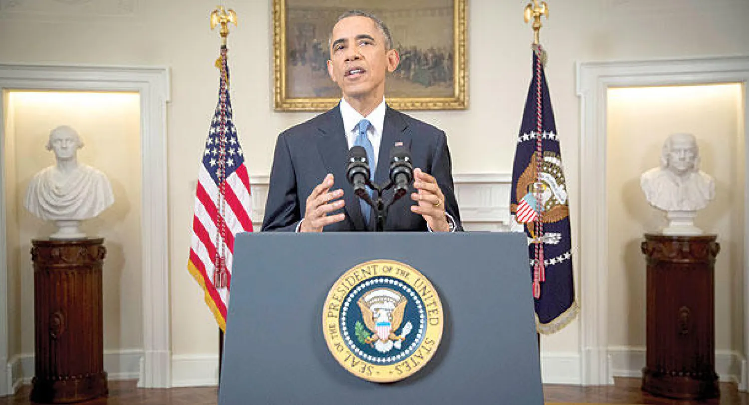 أوباما أثناء إعلانه تطبيع العلاقات بين الولايات المتحدة وكوبا من البيت الأبيض أمس (أ.ب)