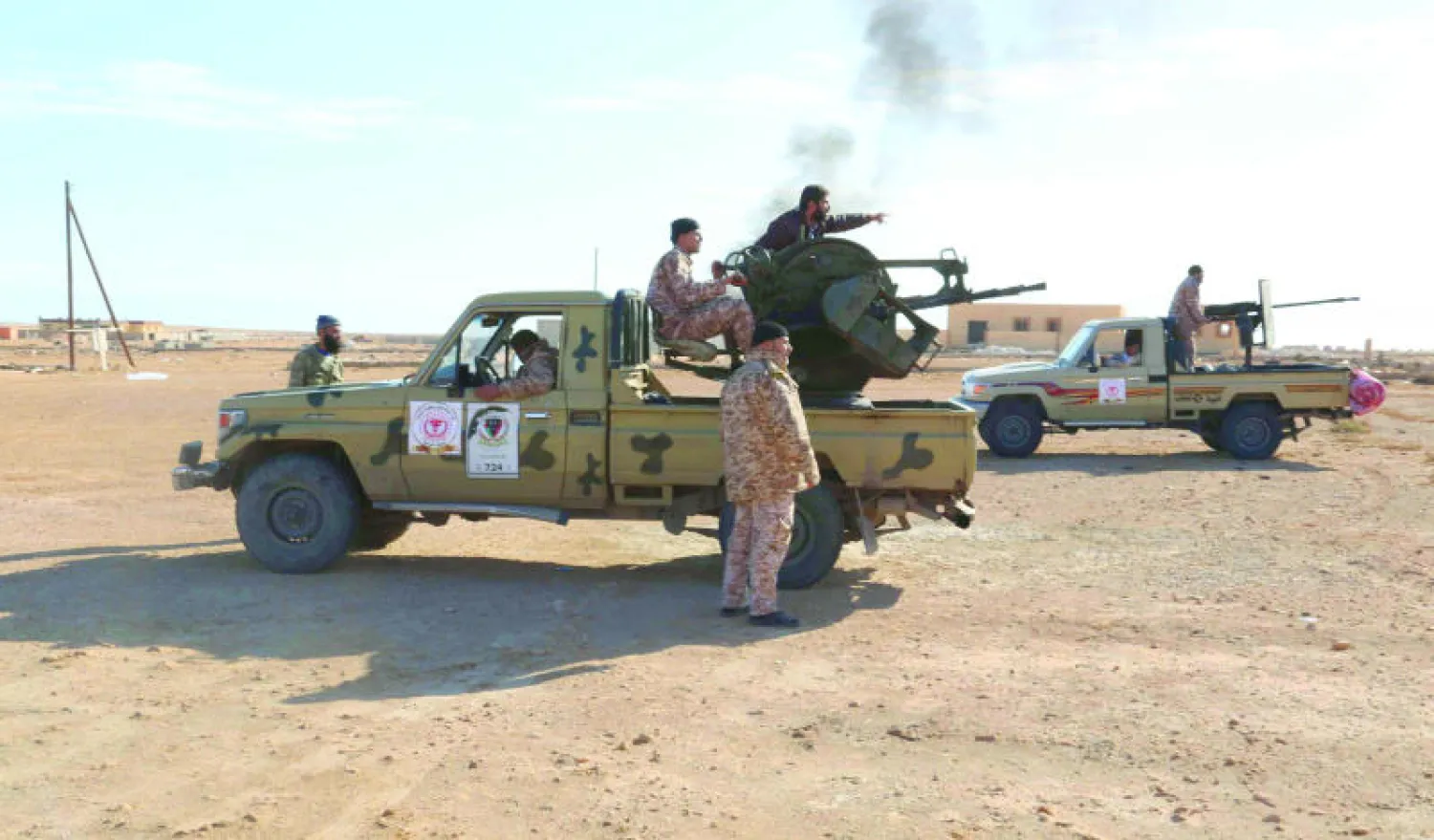 قوات من «فجر ليبيا» خارج ميناء سدرة النفطي أول من أمس (رويترز)