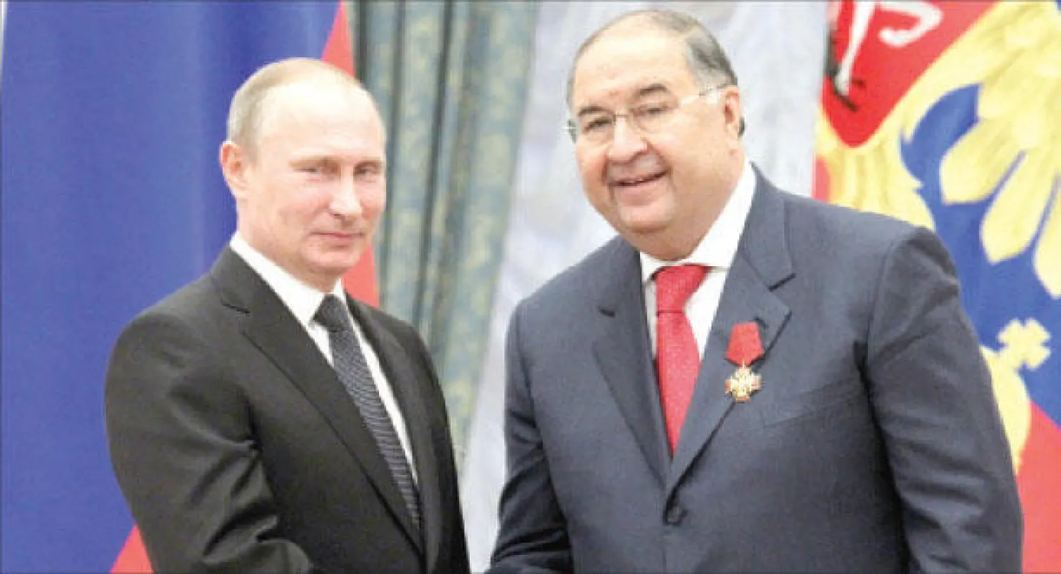 الرئيس الروسي فلاديمير بوتين مع رجل الاعمال اليشر عثمانوف