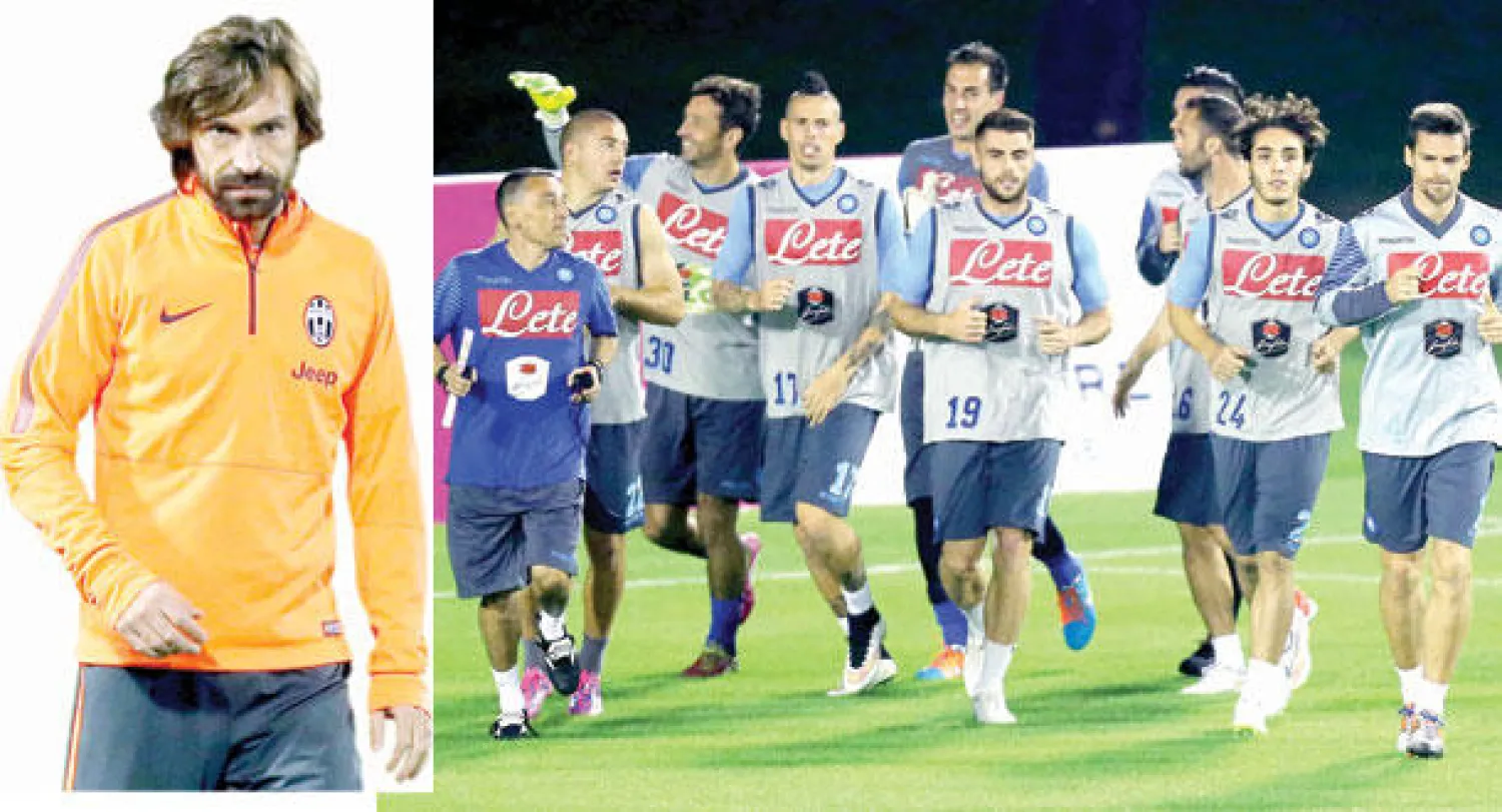 جانب من تدريبات نابولي في الدوحة (أ.ف.ب)  -  بيرلو خلال استعدادات اليوفي لمباراة السوبر الإيطالي غدا (أ.ف.ب)