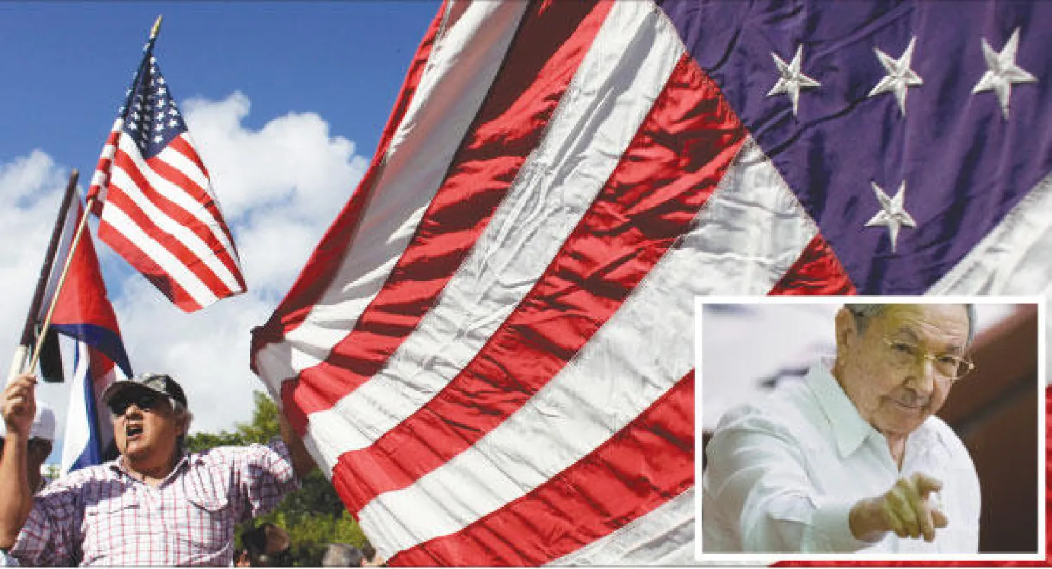 نشطاء يرفعون الإعلام الأميركية في ميامي ضد التقارب الأميركي الكوبي أمس (رويترز) وفي الاطار الرئيس الكوبي راوول كاسترو يرد على أسئلة الصحافيين وقد تعهد في البرلمان أمس بعدم تخلي بلاده عن الشيوعية (أ.ب)