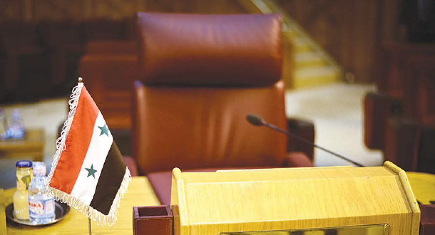 المقعد الفارغ لسوريا في الجامعة العربية أثناء الاجتماع الطارئ الذي عقد بالقاهرة أمس لبحث الصراع الدائر في ليبيا (أ.ف.ب)