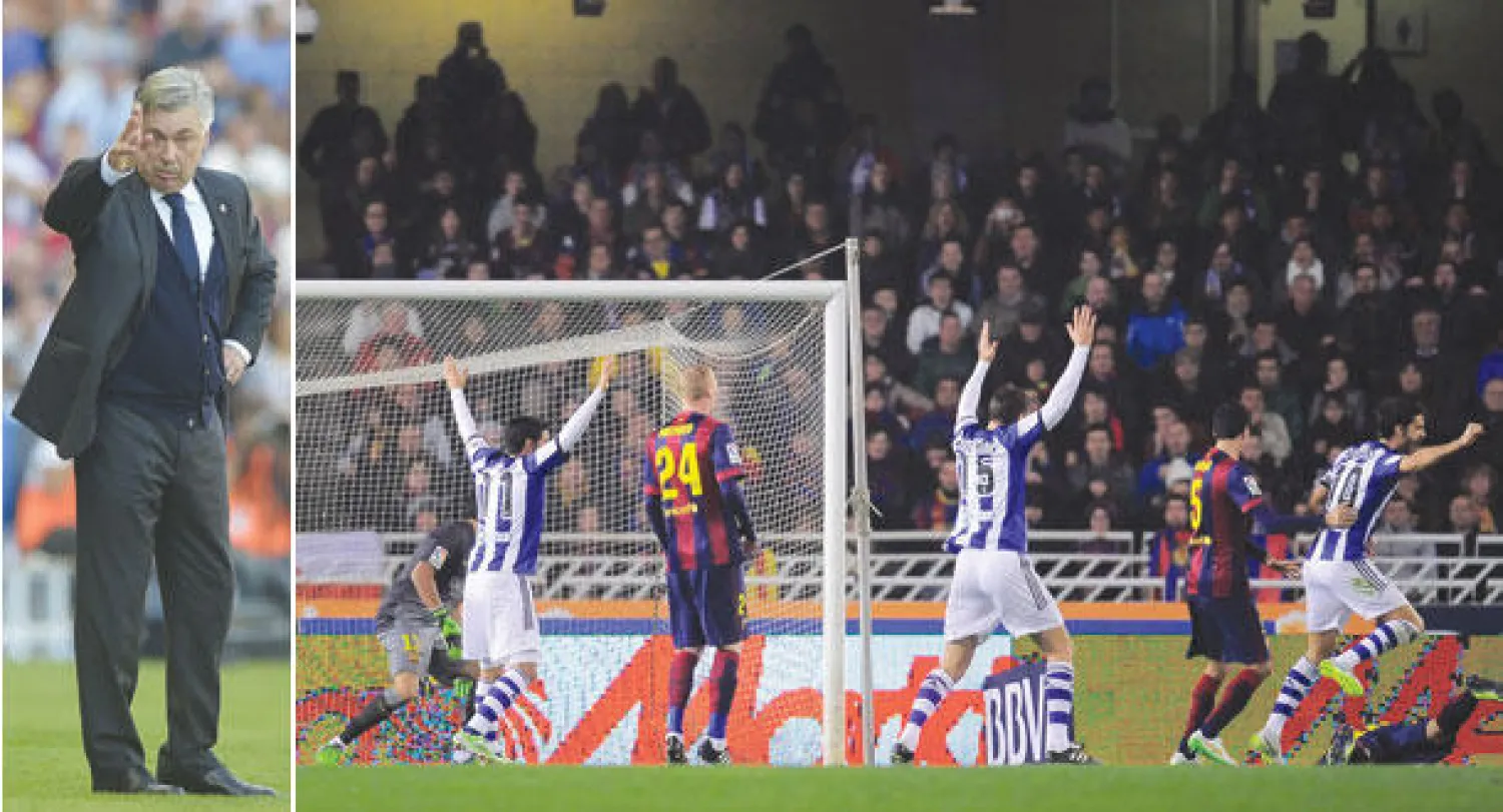 لاعبو سوسيداد يحتفلون بالهدف الهدية الذي سجله خوردي ألبا مدافع برشلونة بالخطأ في مرمى فريقه (أ.ب)  -  أنشيلوتي مدرب الريال يأمل إعادة فريقه للانتصارات أمام أتلتيكو (أ.ف.ب)