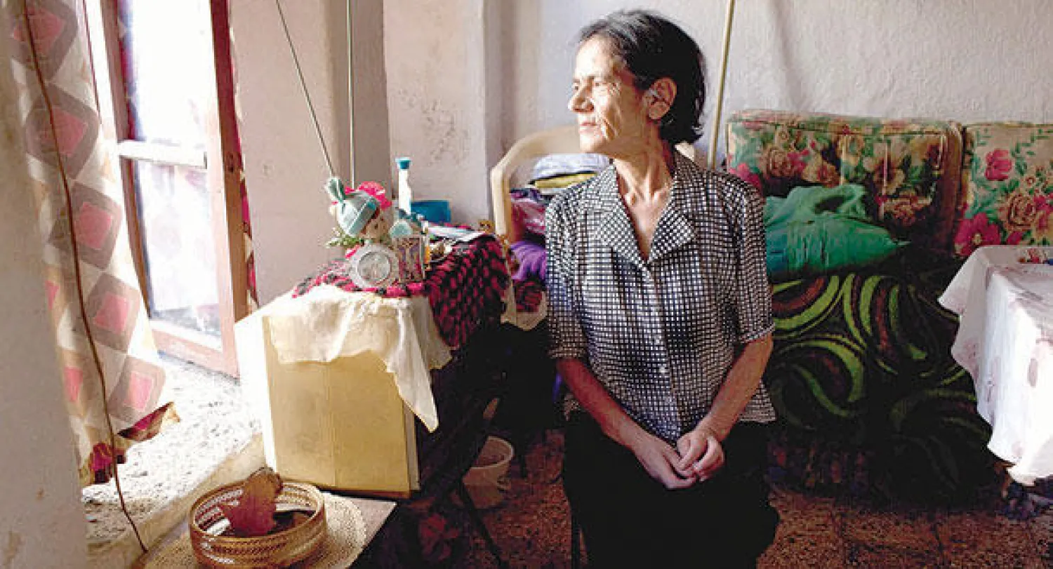 امرأة مسيحية بملجأ للعجزة في مدينة حلب التي تضم اكبر نسبة من المسيحيين السوريين (غيتي ايماجز)