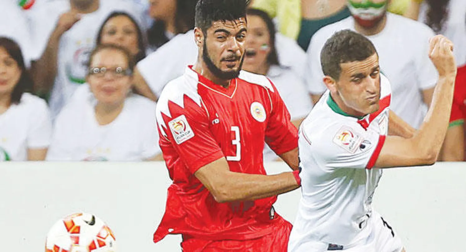 من مباراة إيران والبحرين أمس (رويترز)