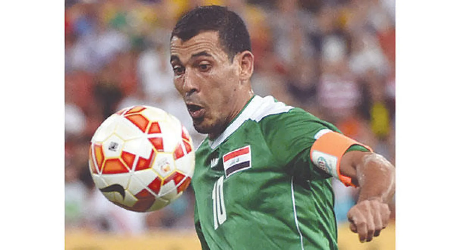 يونس محمود في مباراة منتخب بلاده أمام الأردن أمس (أ.ف.ب)