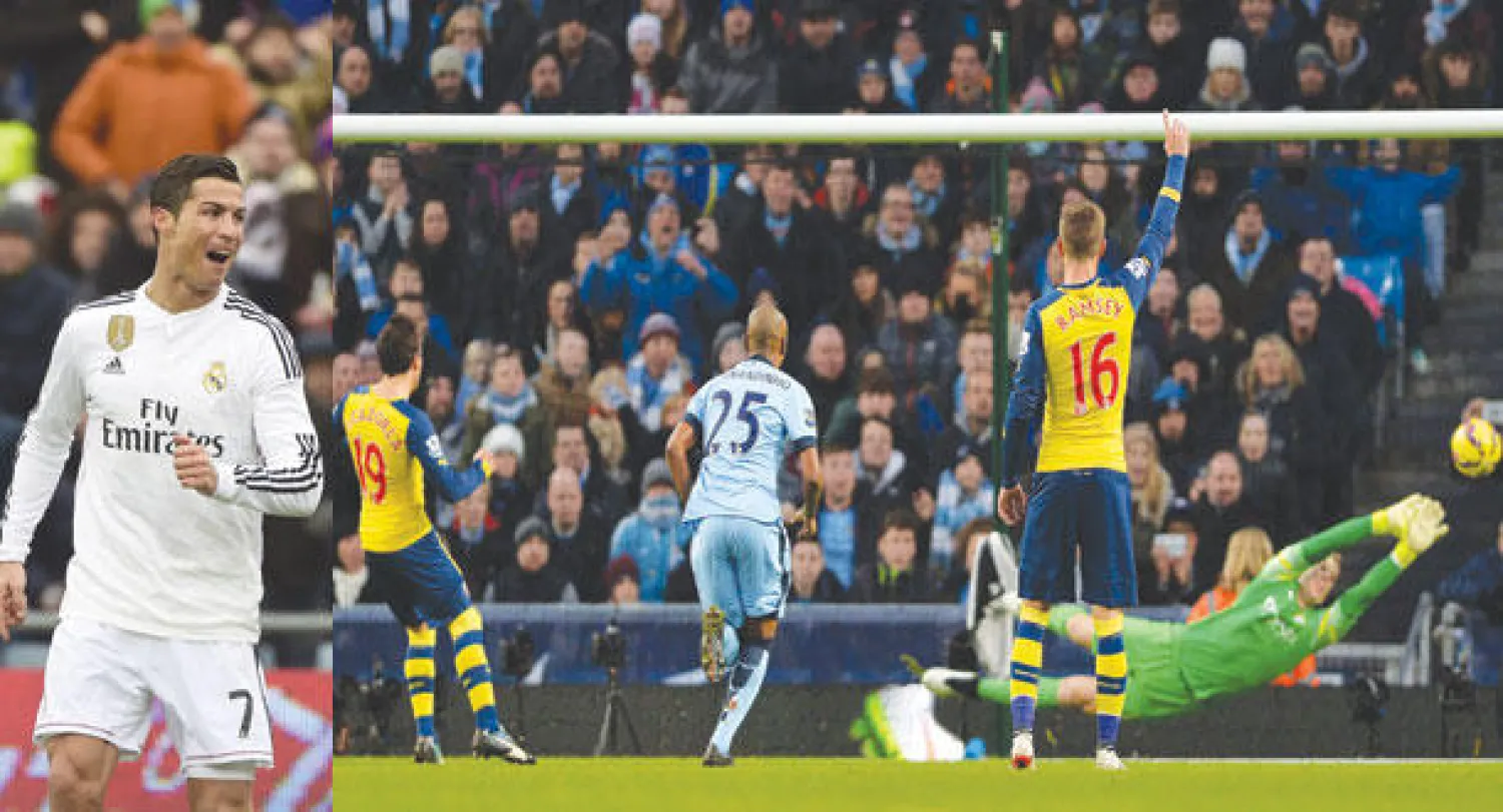 كازورلا نجم آرسنال (يسار) يتابع تسديدته من ركلة الجزاء وهي في طريقها لمرمى سيتي رغم محاولة الحارس جو هارت التصدي لها (إ.ب.أ)  -  رونالدو نجم الريـال يحتفل بهدفيه في
