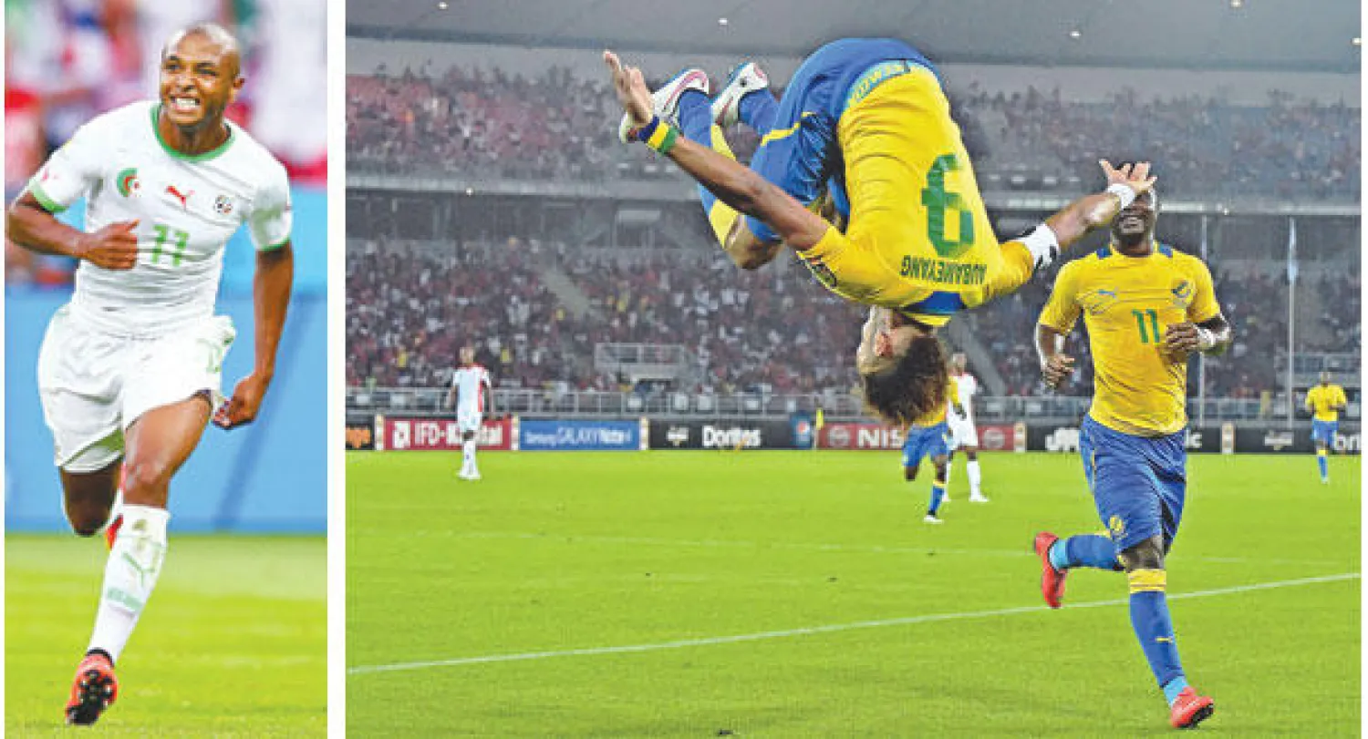 أوباميانغ مهاجم الغابون يحتفل بطريقة أكروباتية بهدفه الأول في مرمى بوركينا فاسو (أ.ف.ب)  -  براهيمي ورقة الجزائر المهمة في مواجهة