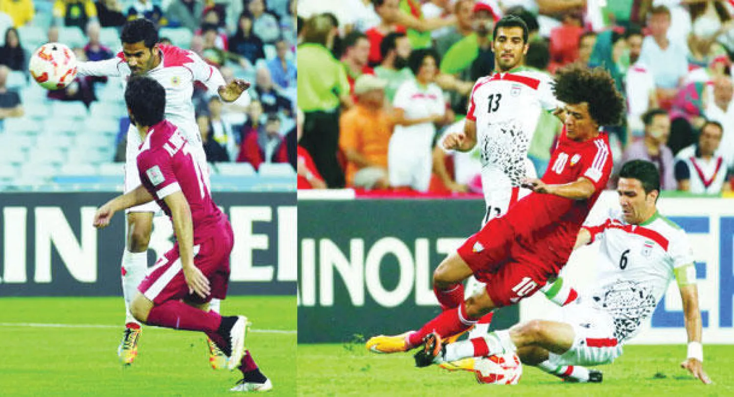 من مباراة الإمارات وإيران أمس (رويترز)  -  جانب من المواجهة التي جمعت البحرين وقطر (أ.ف.ب)